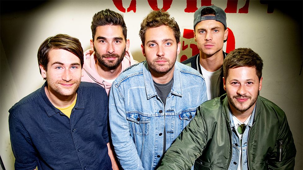 The five male band members. Max Helyer, Chris Miller, Josh Franceschi, Matt Barne and Dan Flint of You Me At Six pose for a photoshoot.