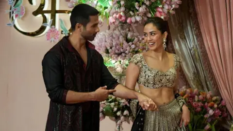 Reuters Bollywood actor Shahid Kapoor and his wife Mira Rajput arrive on the red carpet during the sangeet ceremony of Anant Ambani and Radhika Merchant at Jio World Centre, Mumbai, India, July 5, 2024.